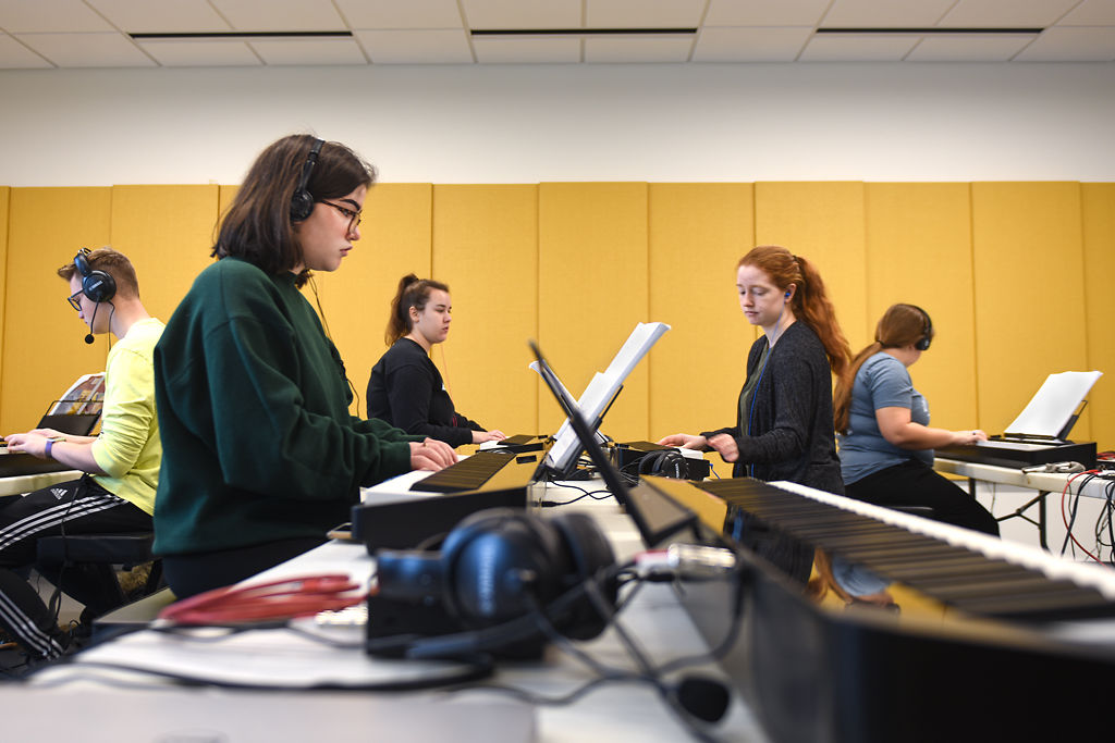 Music majors attend their Level 2 group piano class
